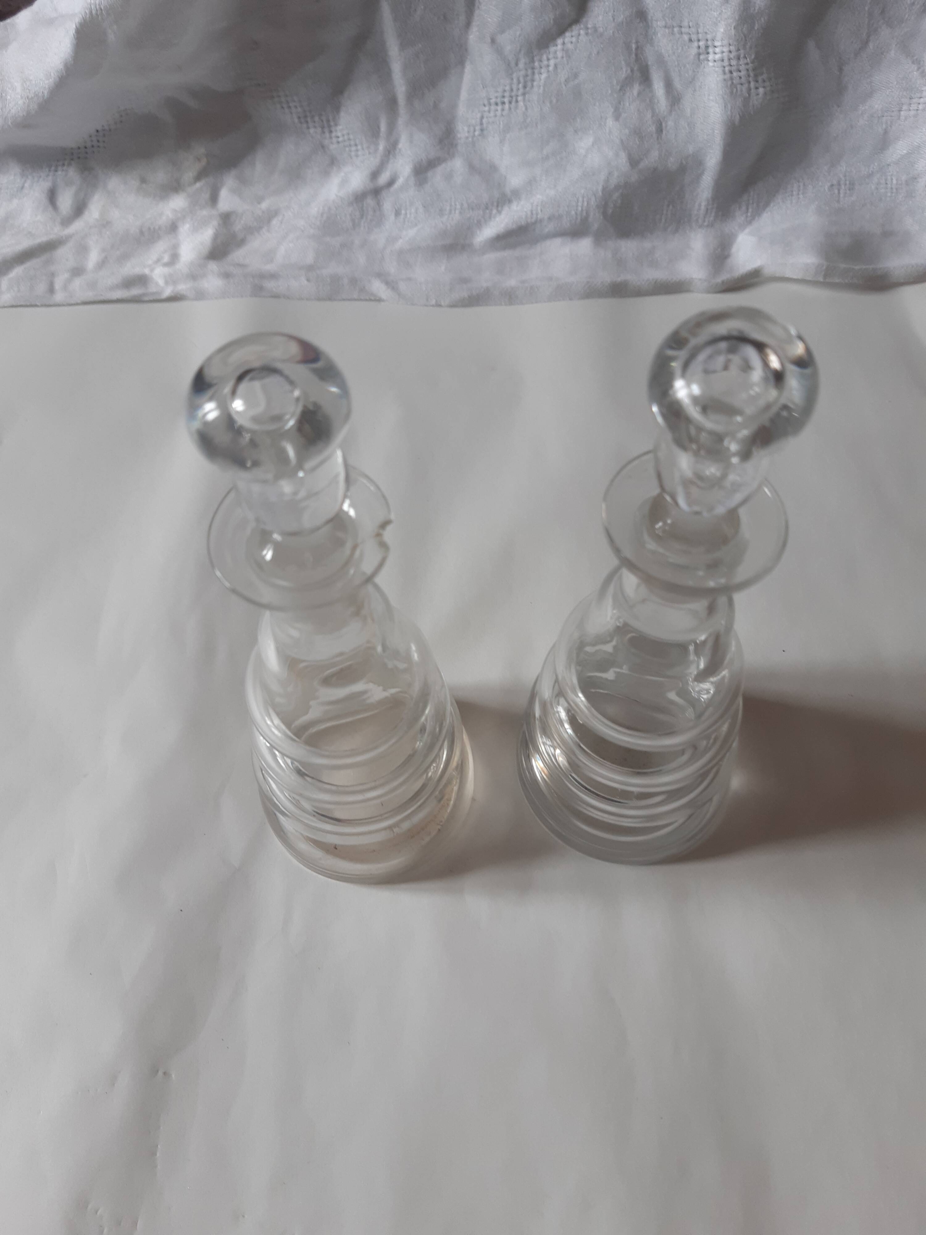 Set of two oil and vinegar glass cruets.