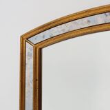 Mirror by Deknudt with marbled fume glass side panels in gilded wooden fram