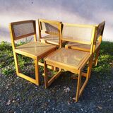 Four trendy tanned wooden chairs