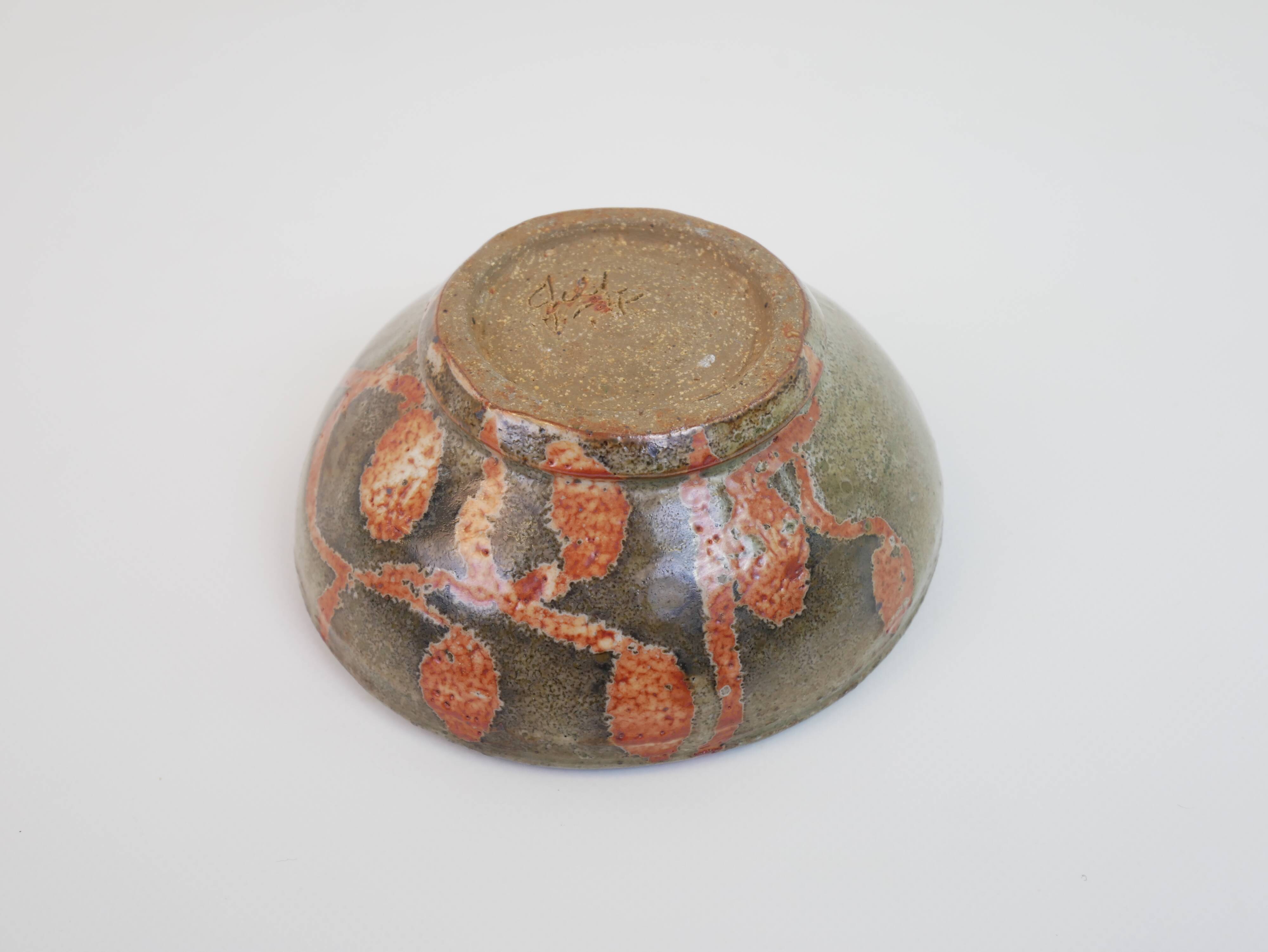 Small bowl in water green glazed ceramic with coral pink pattern