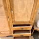 Asymmetrical wardrobe in raw wood