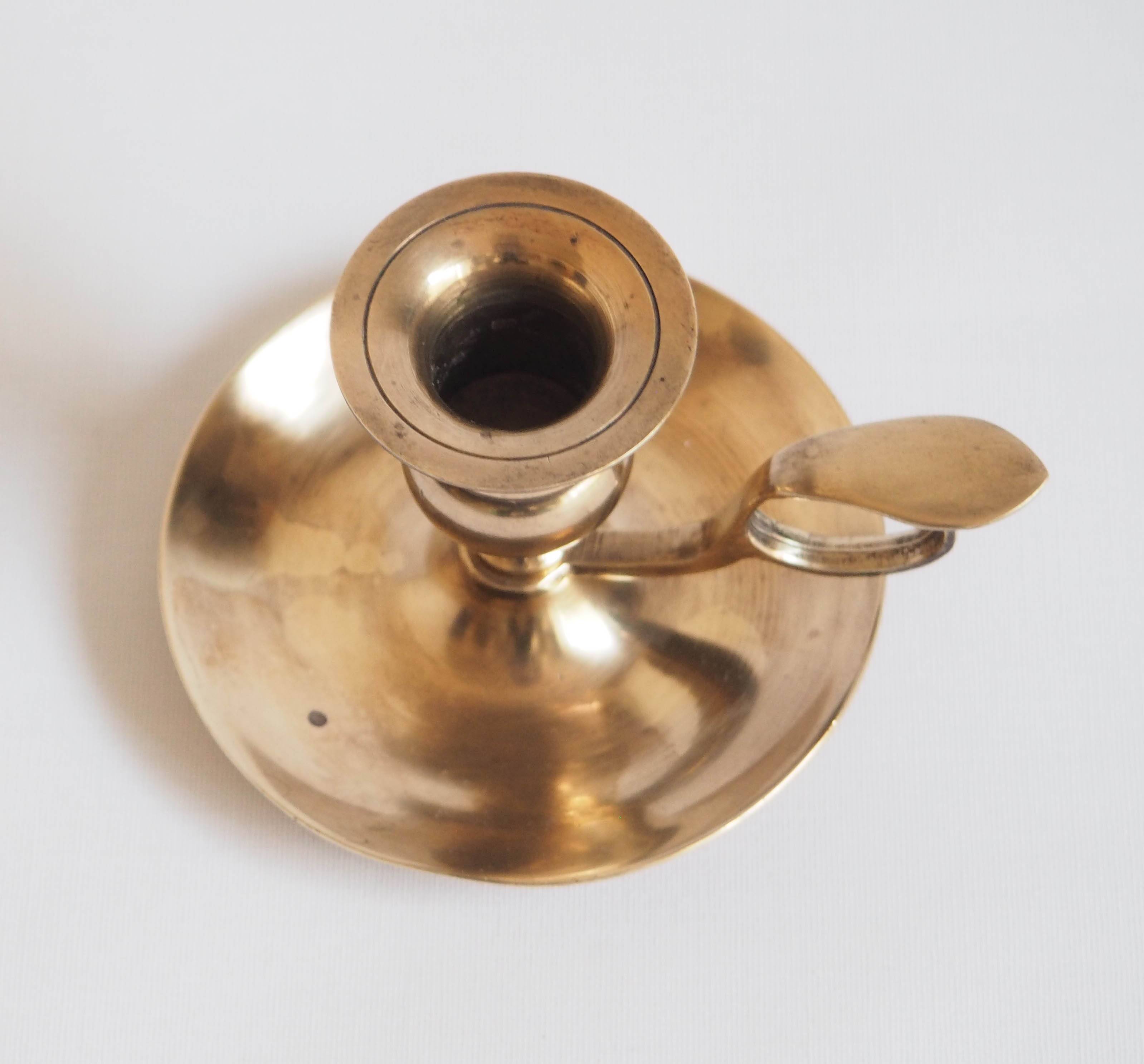 Brass candle holder with cup and handle