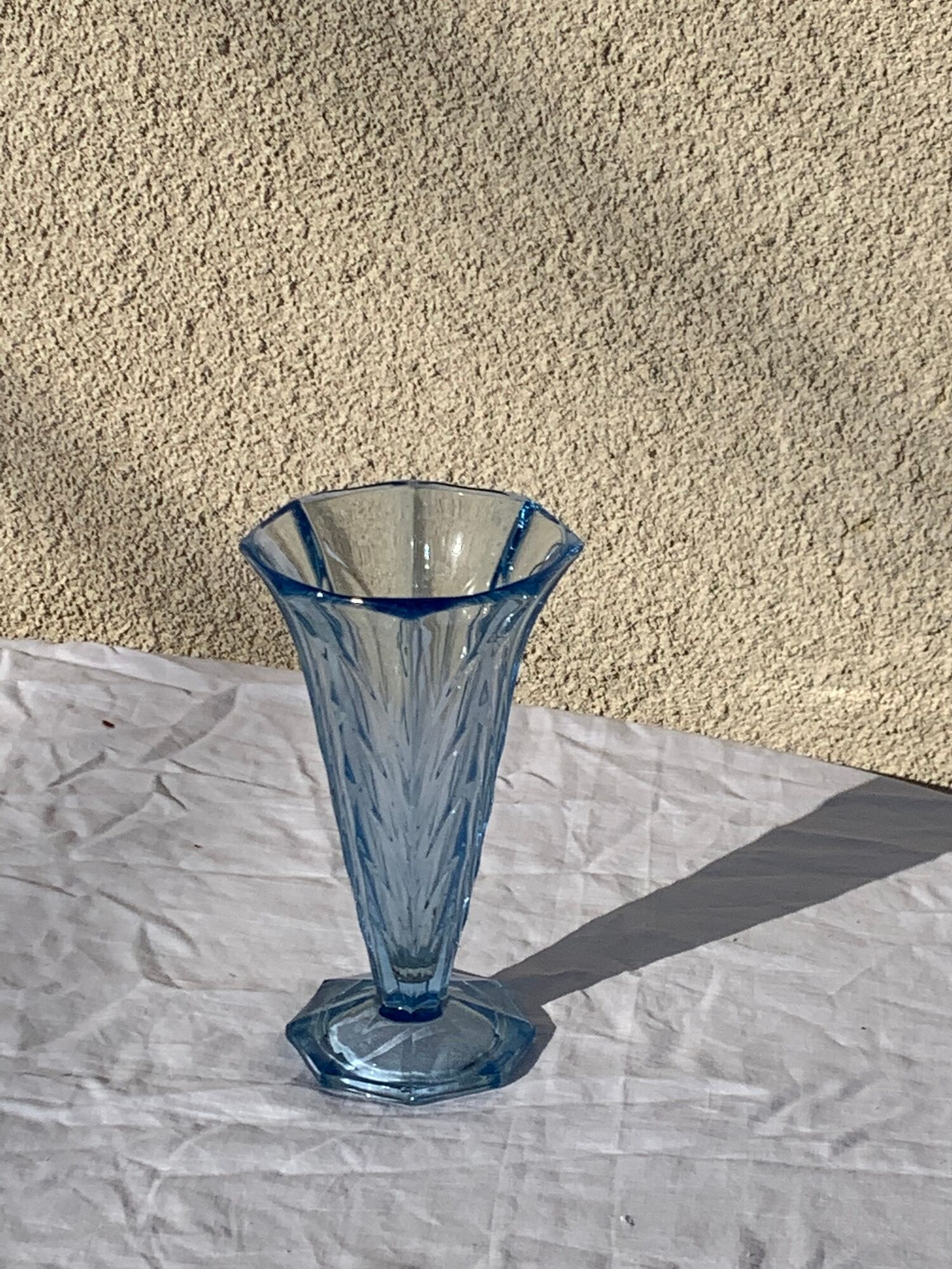 Blue molded glass vase in art deco relief