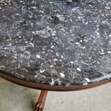 Round pedestal table with marble top and mahogany tripod from the 19th century