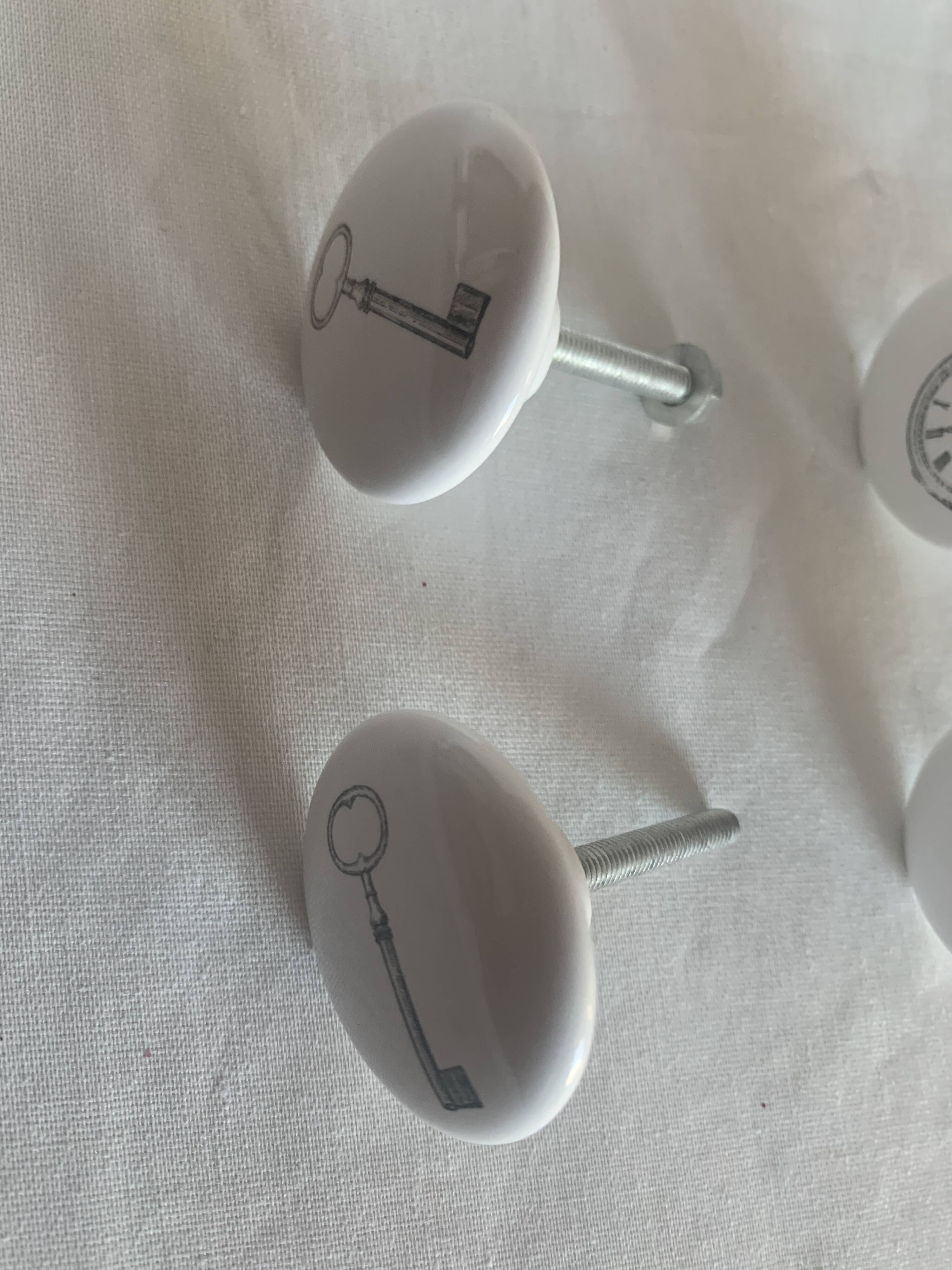 white ceramic door knobs with illustration