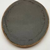 Antique oval gilded mirror with wooden frame and stucco detail