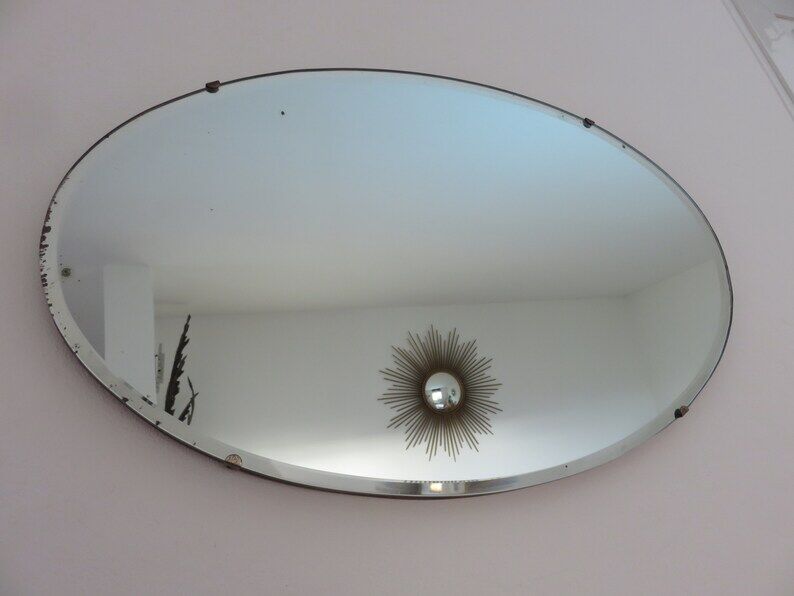 Beveled wall mirror, oval, on wood, with chain Art Deco years 30 40