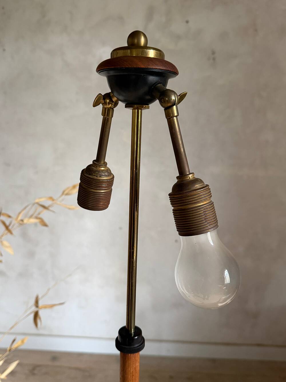 Scandinavian tripod reading lamp in teak and brass.