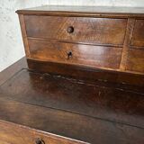 Wooden lady's desk says "happiness of the day"