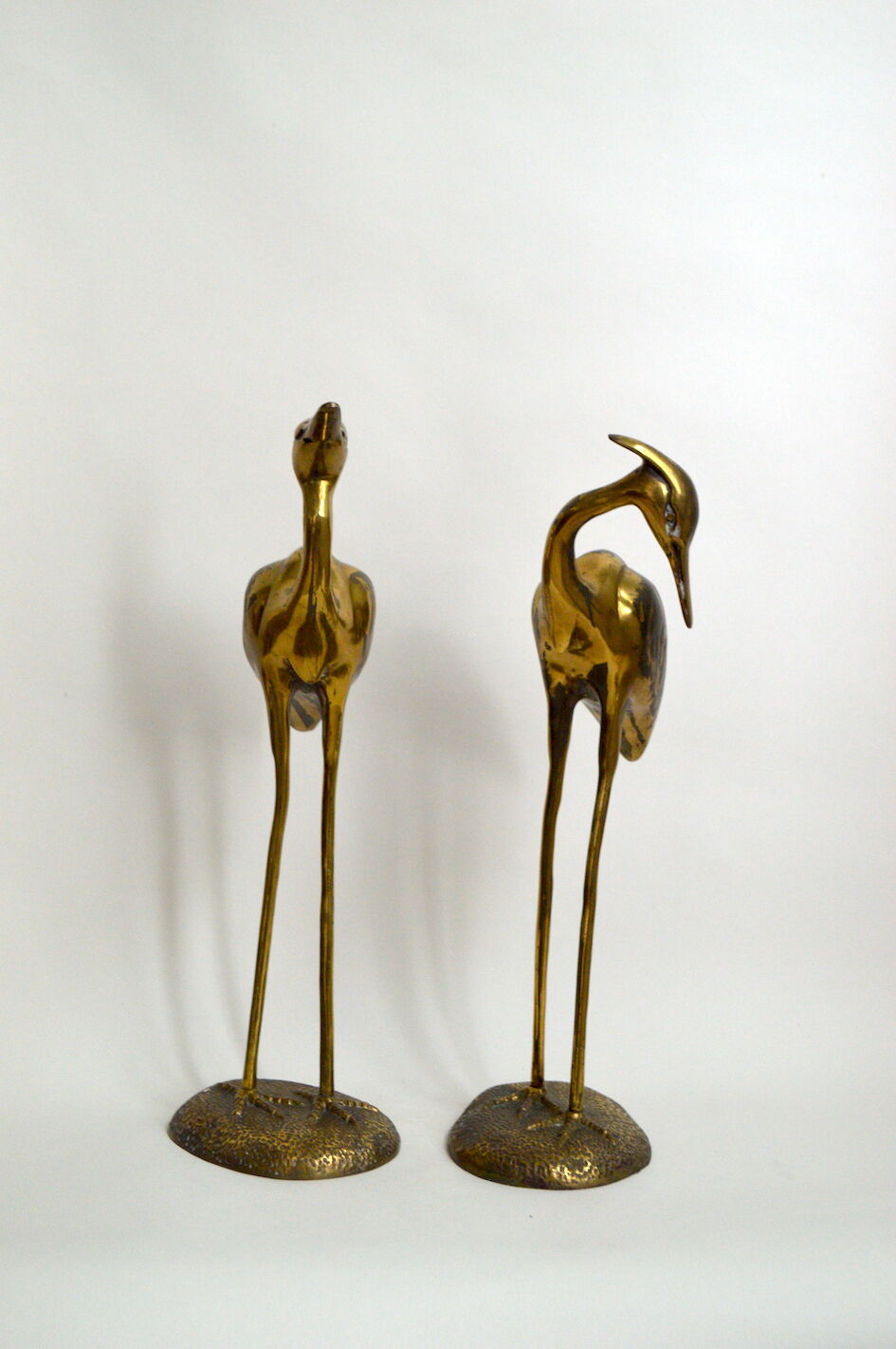 Brass herons couple