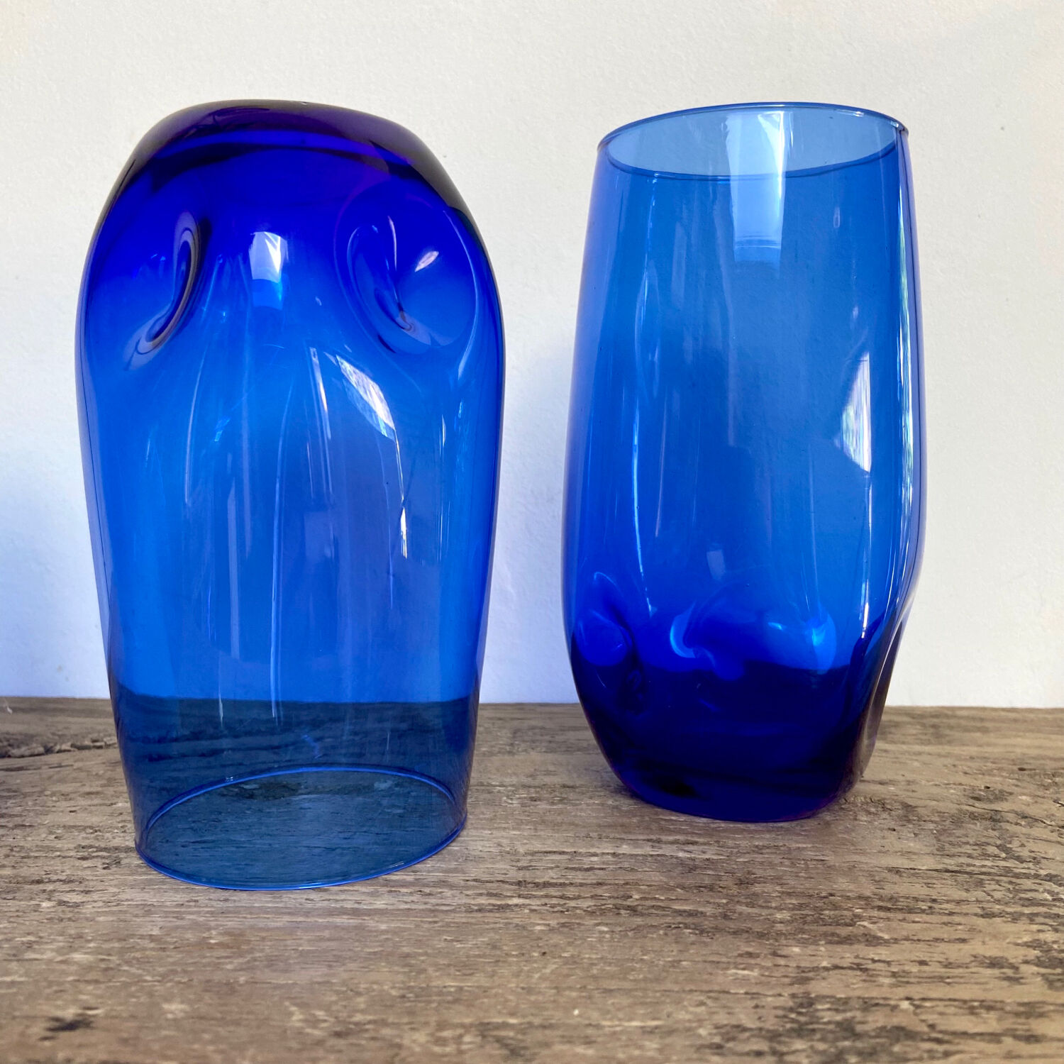3 blue colored long drink glasses