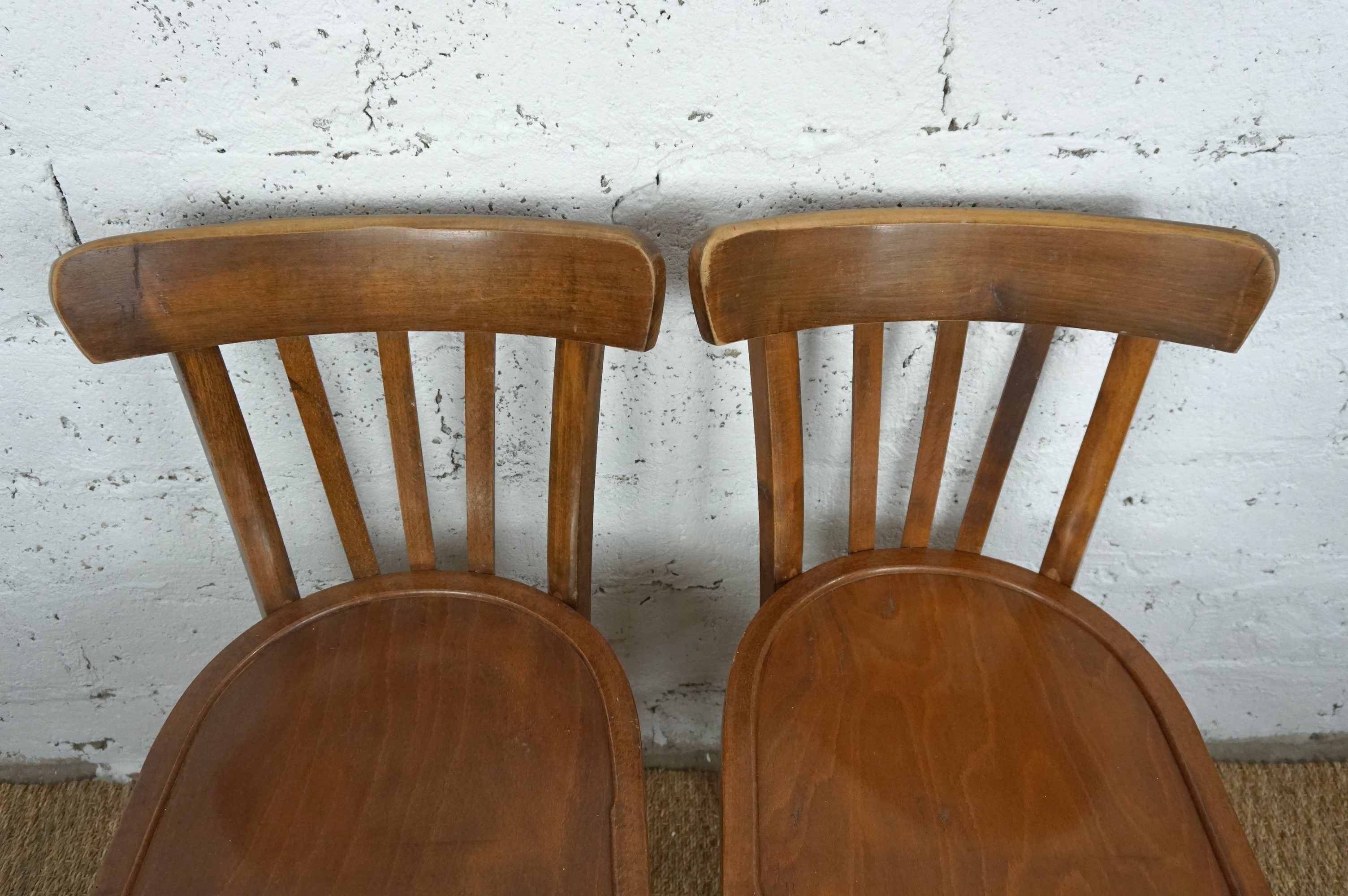 pair of vintage wooden bistro chairs
