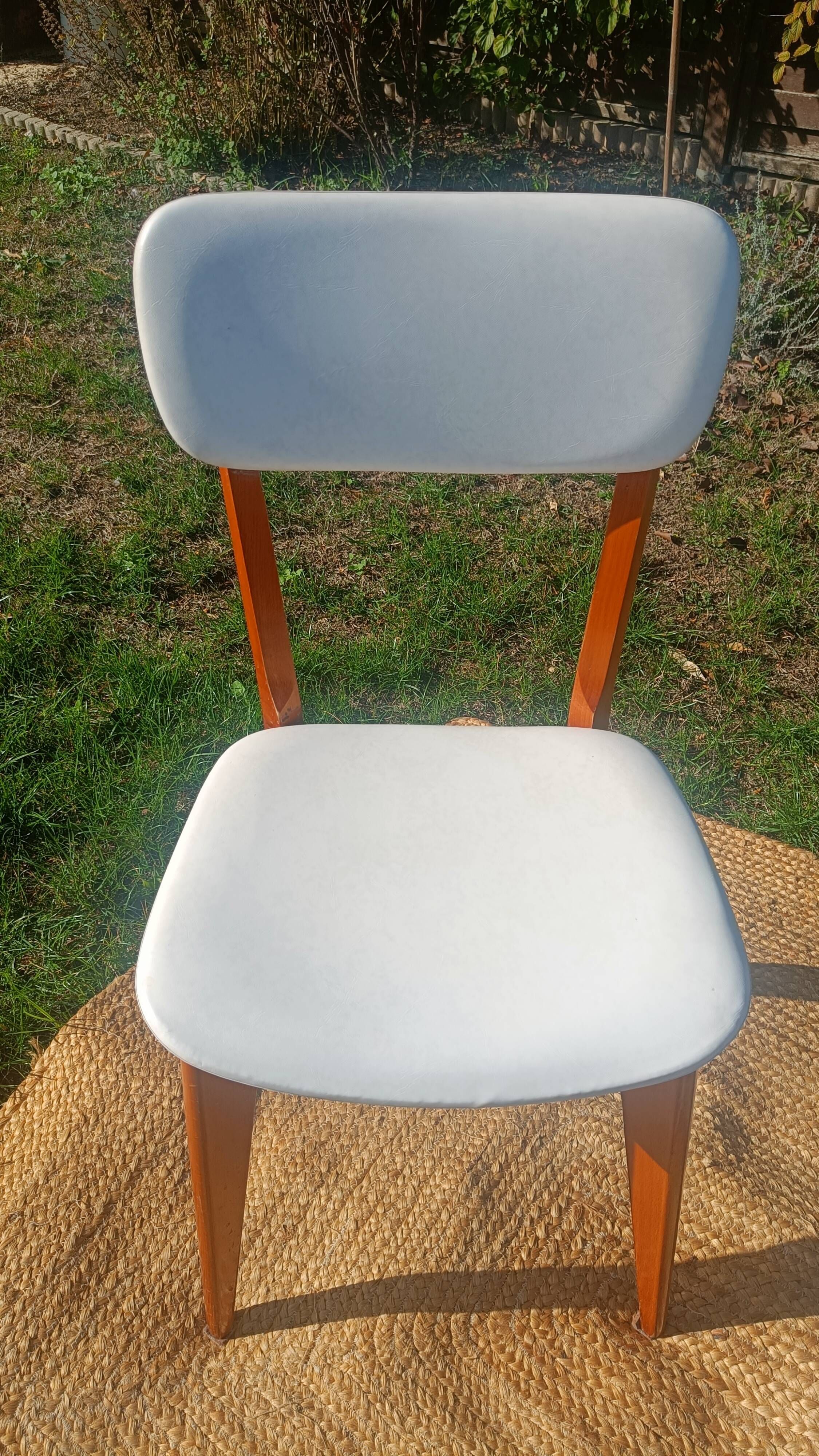 vintage wooden chairs with white faux leather