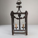 Wrought iron lantern with glass panels, leaf motifs