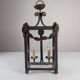 Wrought iron lantern with glass panels, leaf motifs