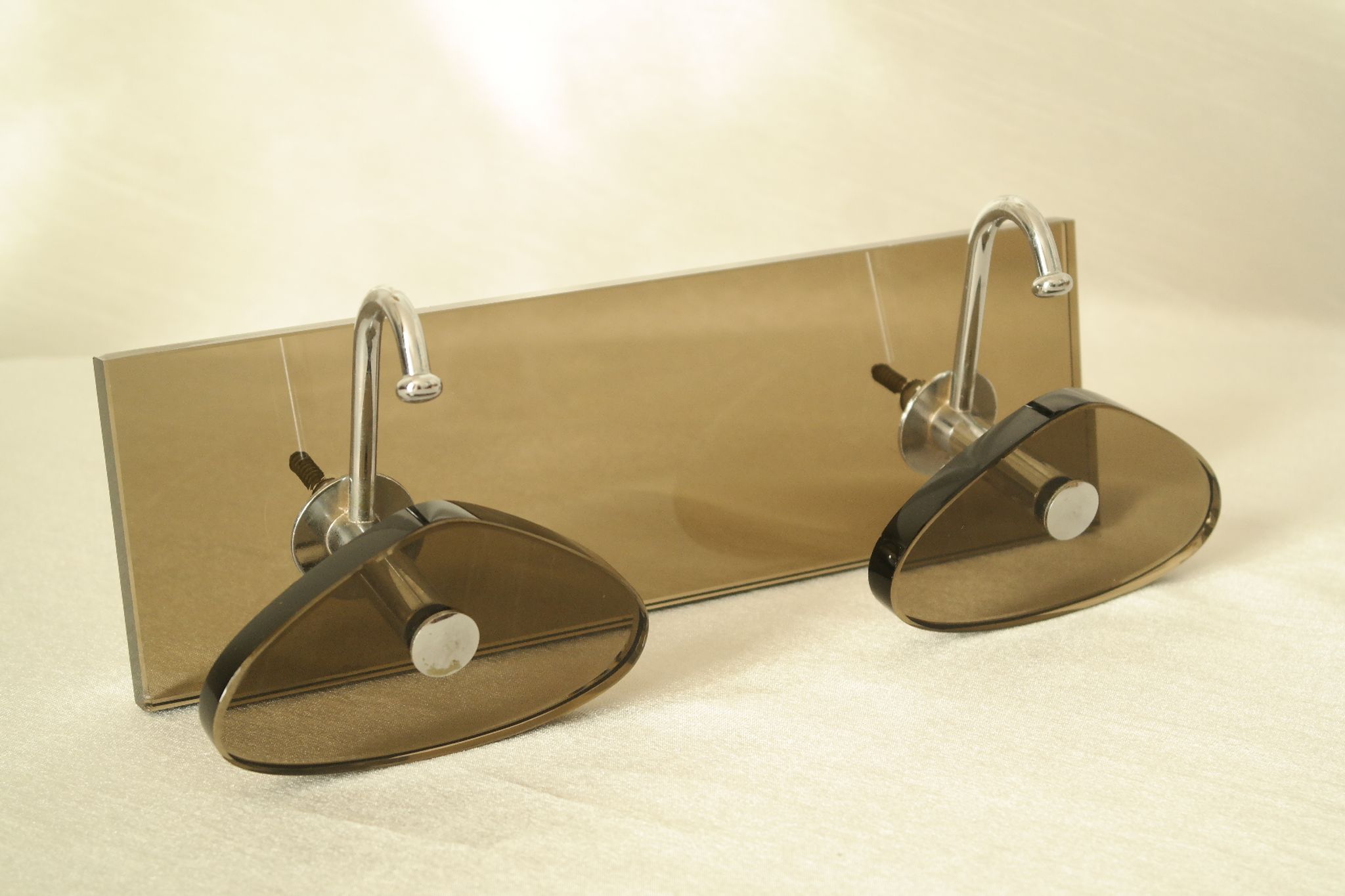 Brown smoked glass coat hook from the 1970s.