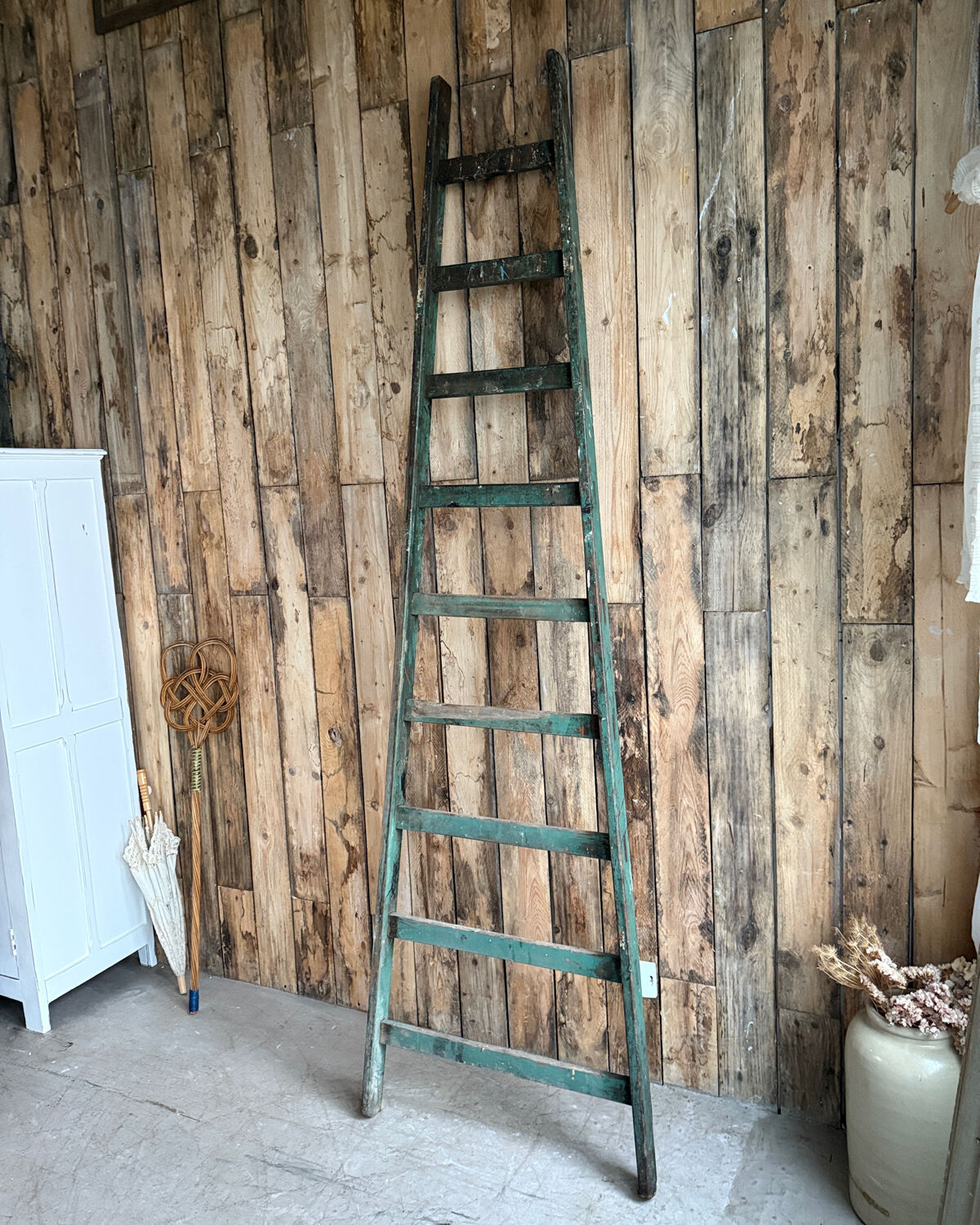 Antique ladder with green patina