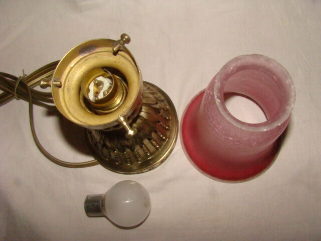 bronze bedside lamp with a pink cracked glass shade