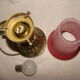 bronze bedside lamp with a pink cracked glass shade