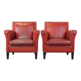 Set of 2 red-colored design armchairs made of sheepskin leather
