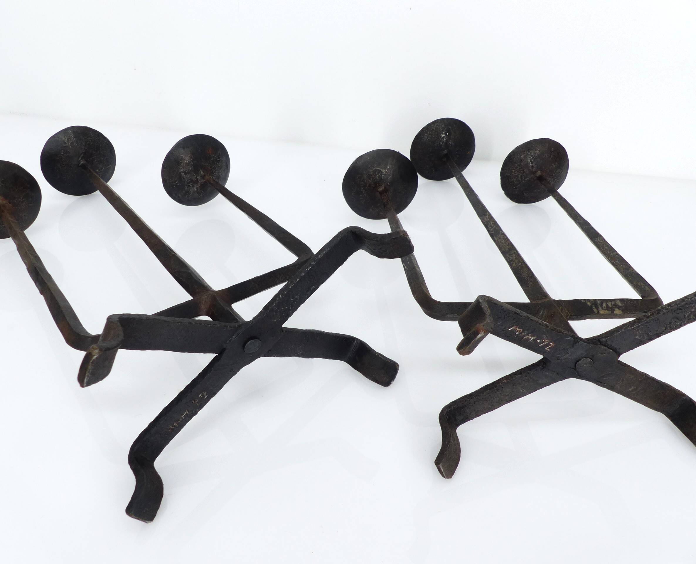 Pair of brutalist wrought iron candlesticks, France, three lights, signed