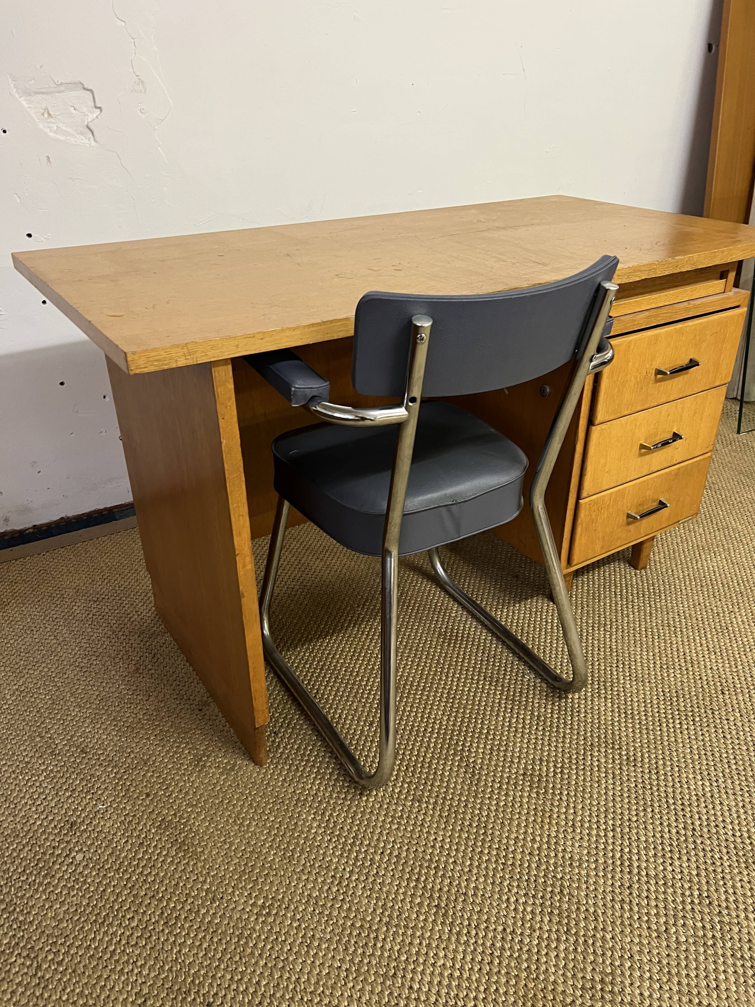 Old wooden desk and armchair