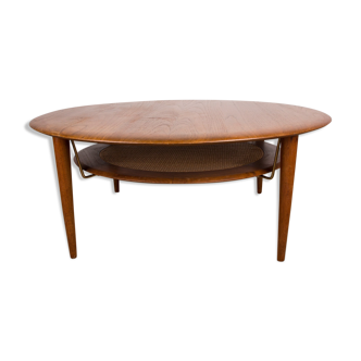 Round coffee table, two levels, danish in teak, brass and cannage
