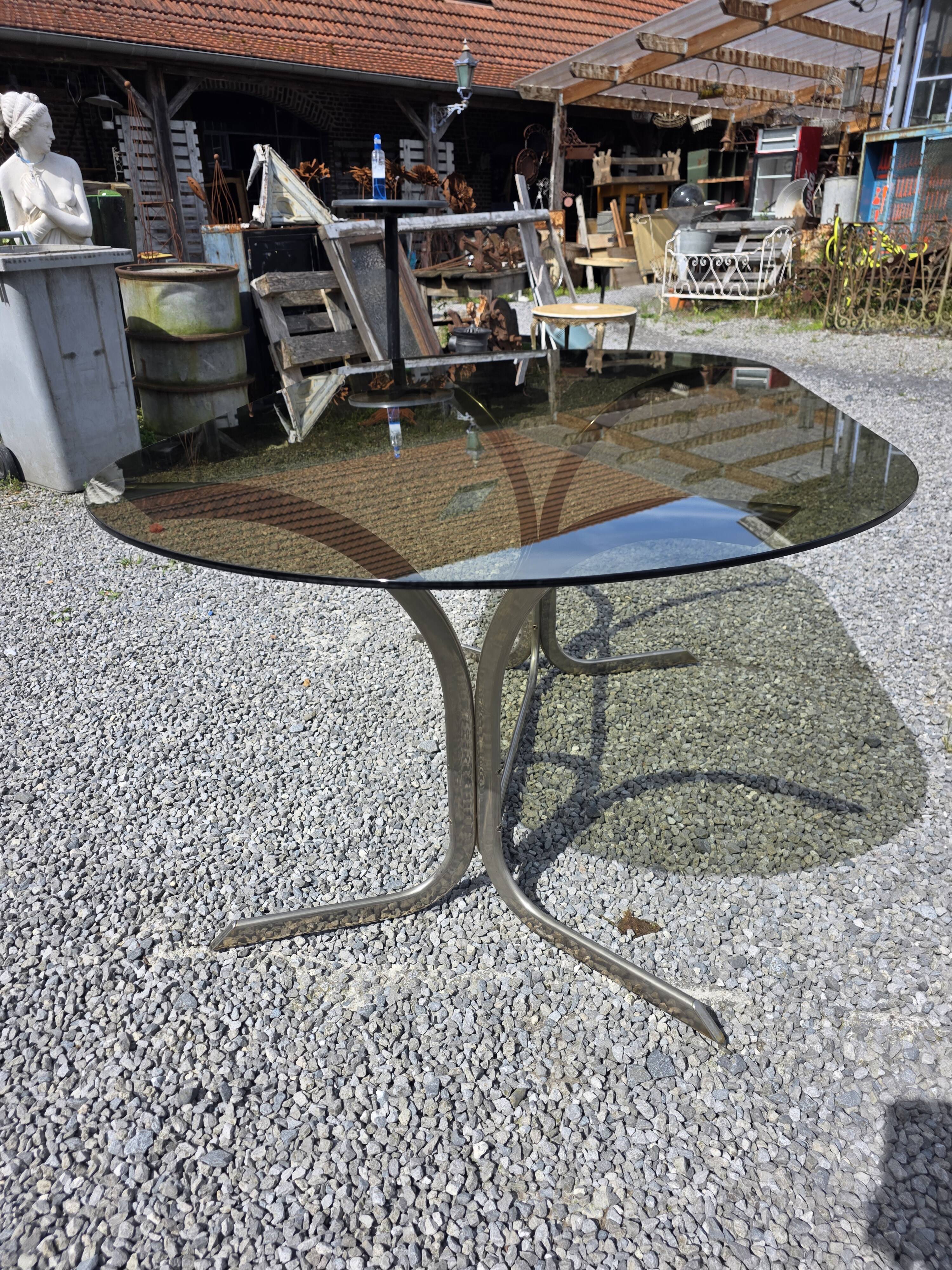 Silver metal table with smoked glass top from the 1970s.