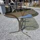 Silver metal table with smoked glass top from the 1970s.