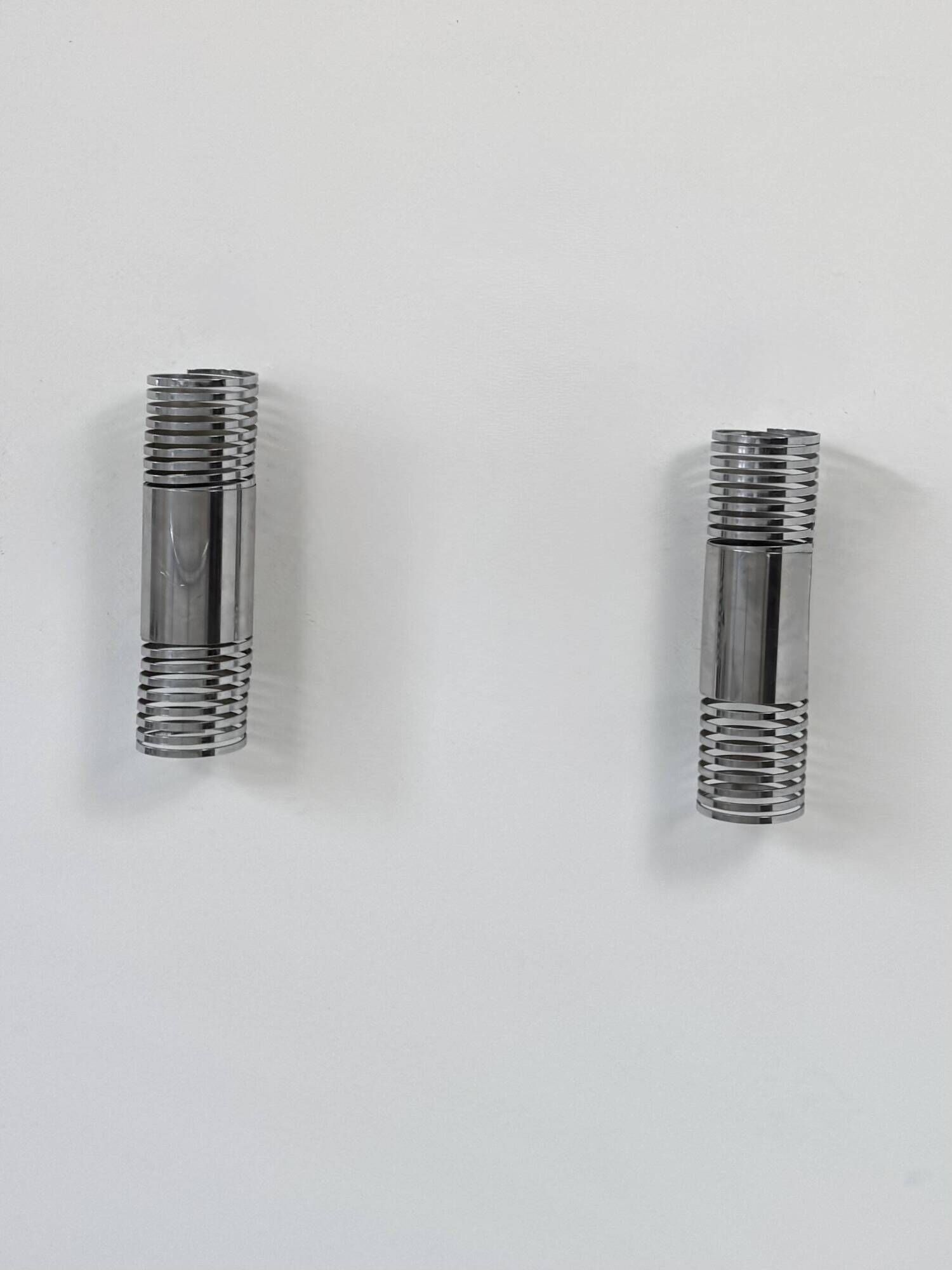 Pair of vintage chrome metal wall lights, France 1970.