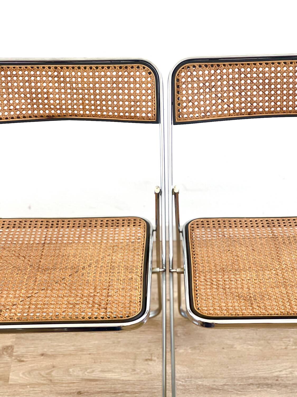 Pair of folding cane chairs