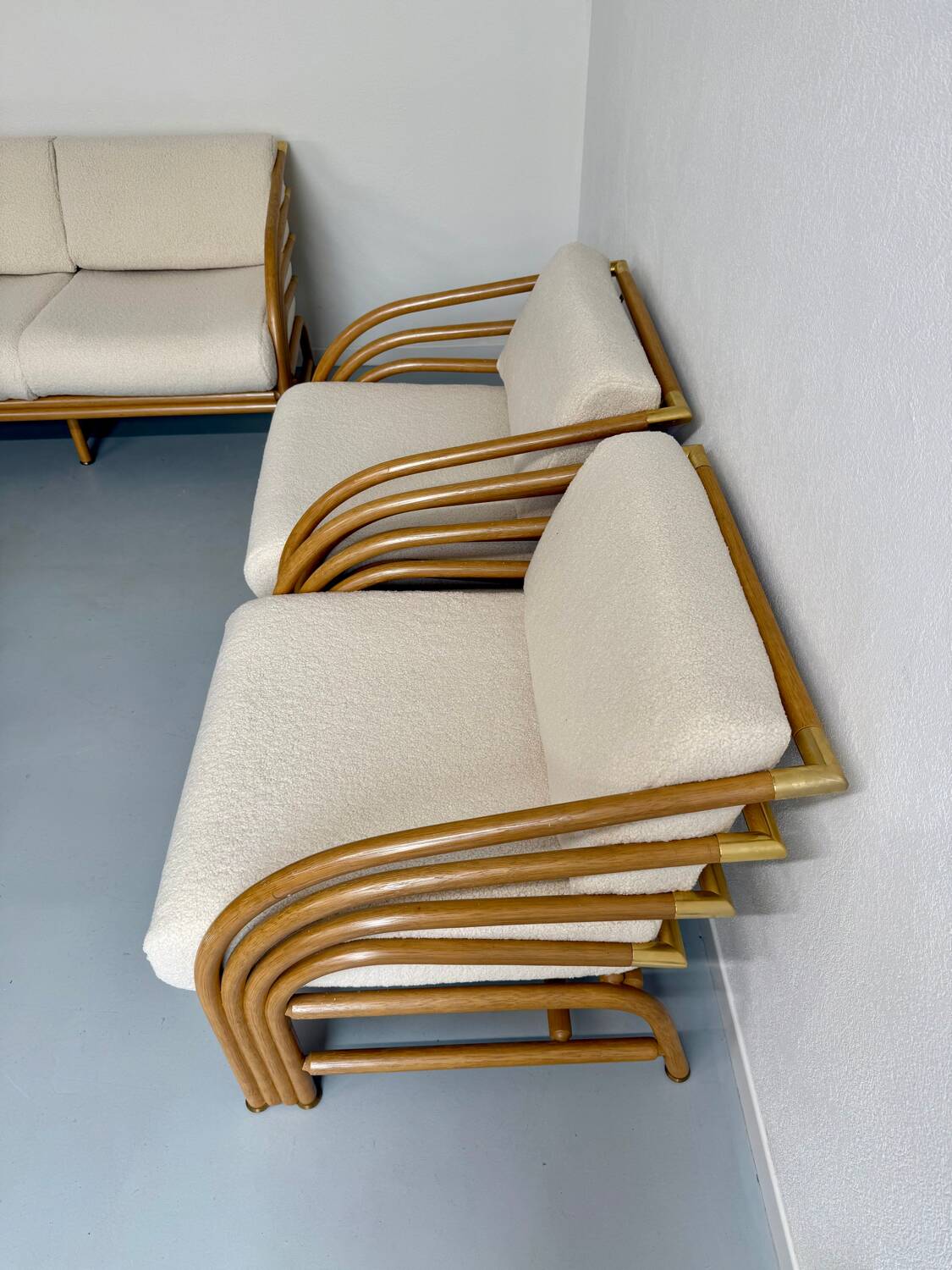 Complete living room with rattan sofa and white bouclette, brass finish, 80's design