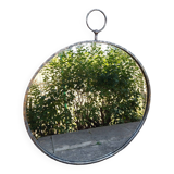 Round patinated mirror