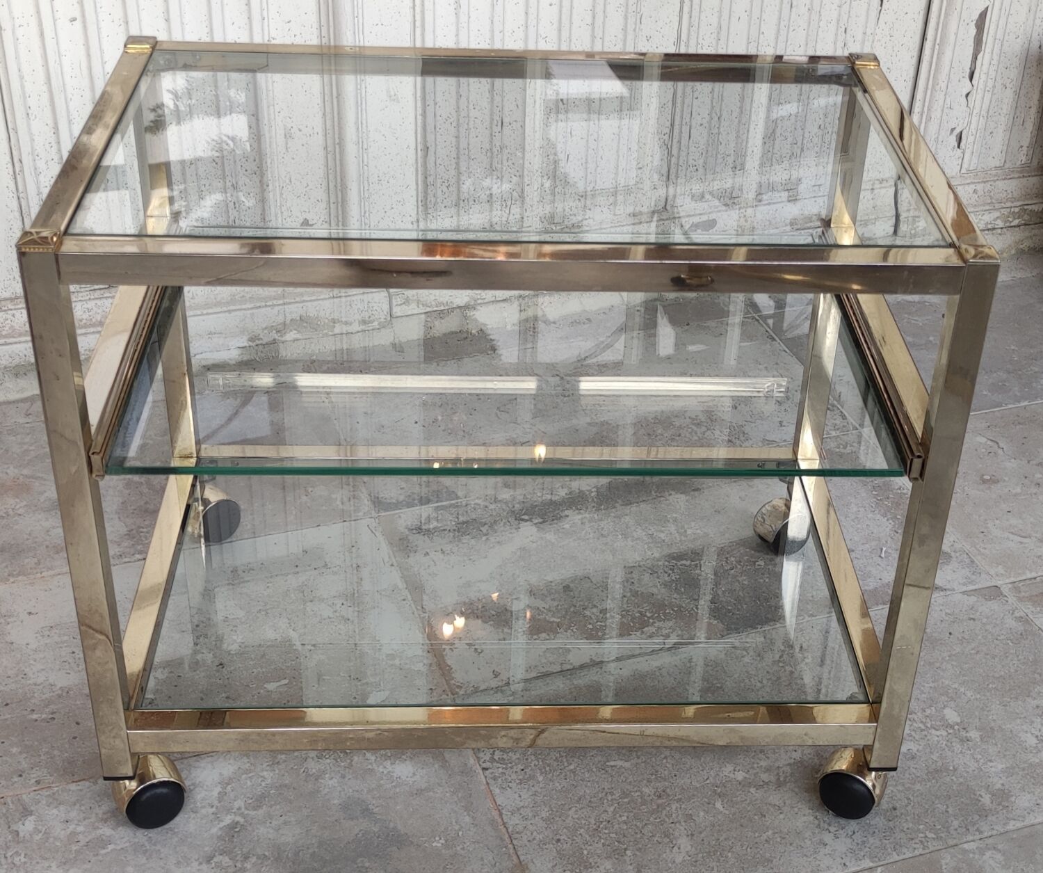 Rolling console service design / gold metal and glass