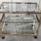 Rolling console service design / gold metal and glass