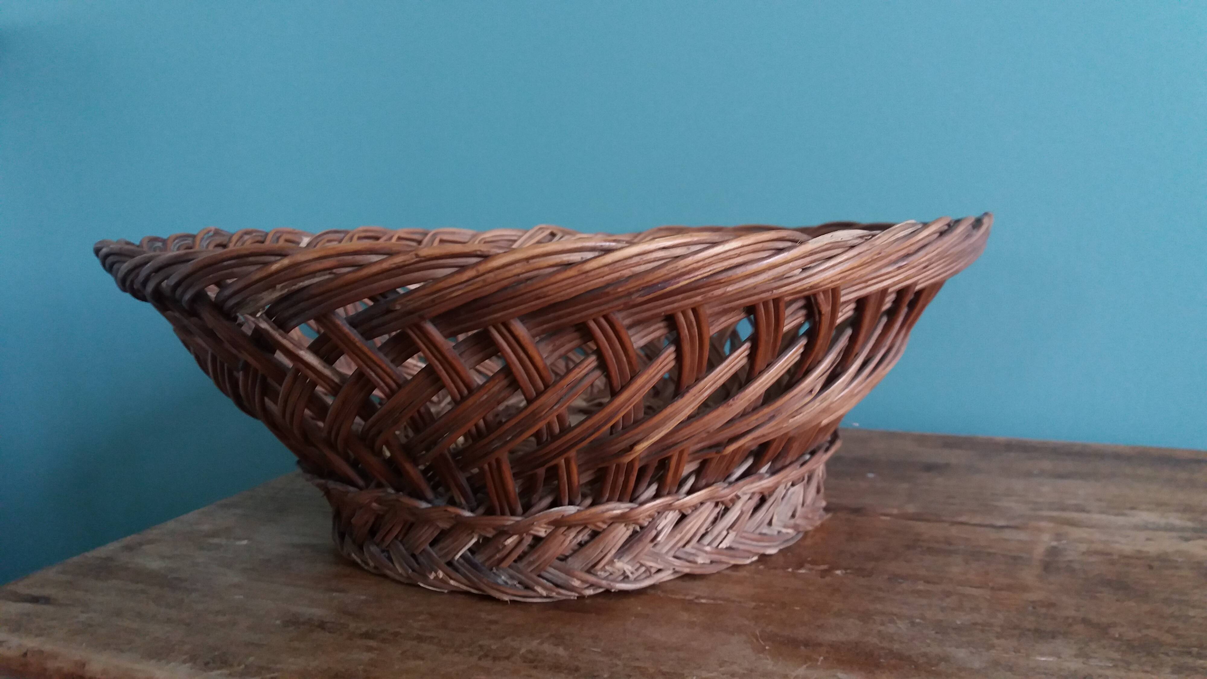 Antique basket, fruit basket or bread basket made of wicker