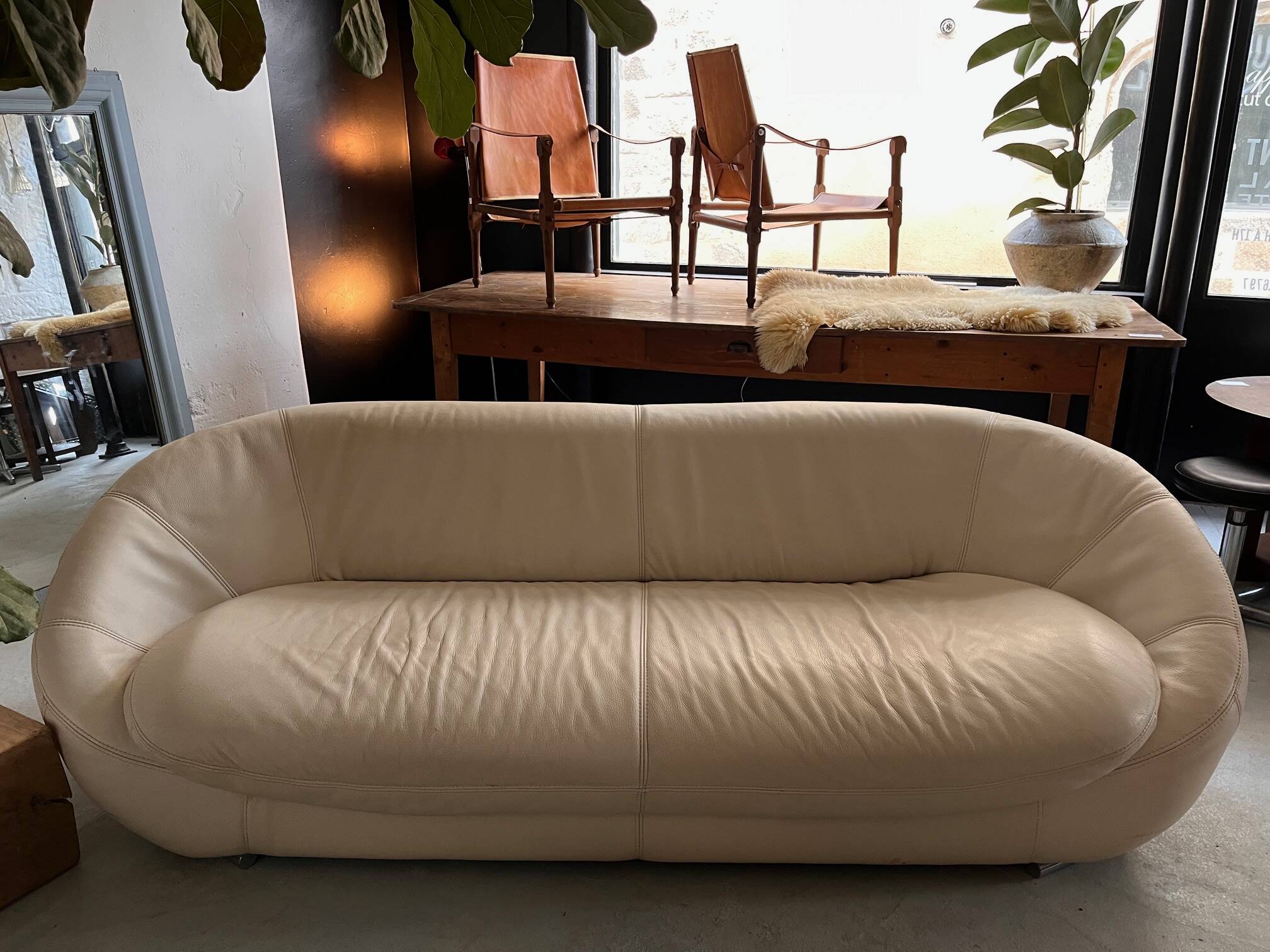 Rounded off-white leather sofa
