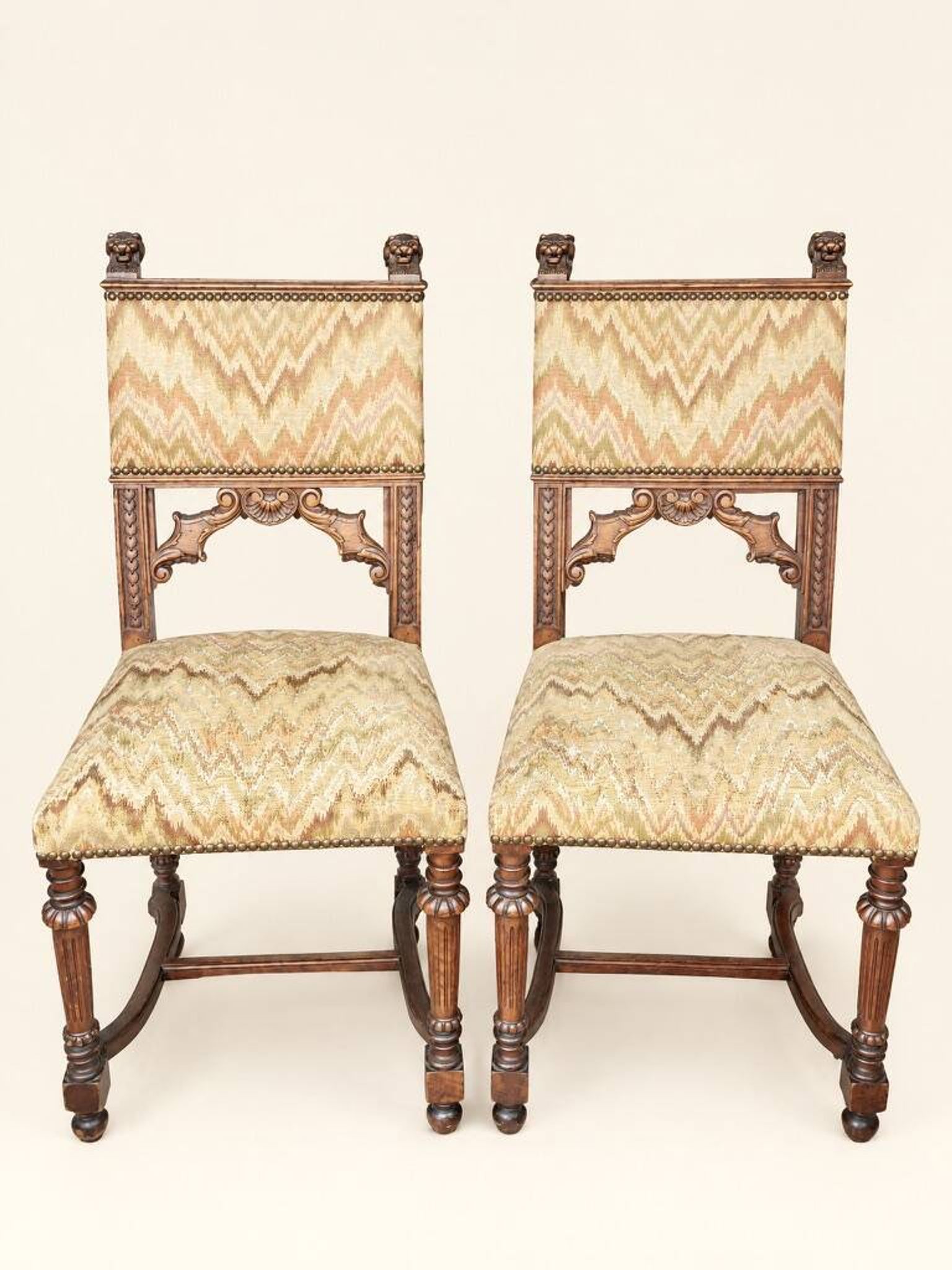 Pair of dining chairs, pair of carved Gothic chairs, set of Renaissance chairs.