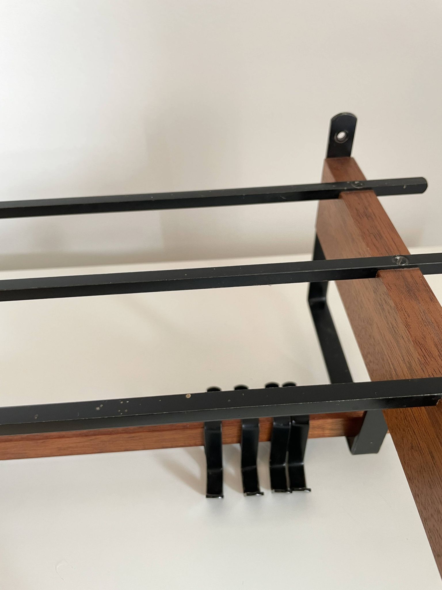 Vintage Scandinavian wall coat rack in wood and metal.