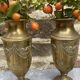 Pair of embossed brass bud vases stamped 17 cm