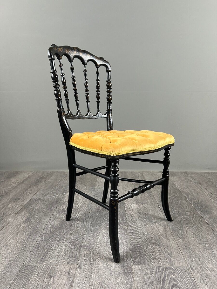 Set of four Napoleon III chairs in blackened wood, 19th century.
