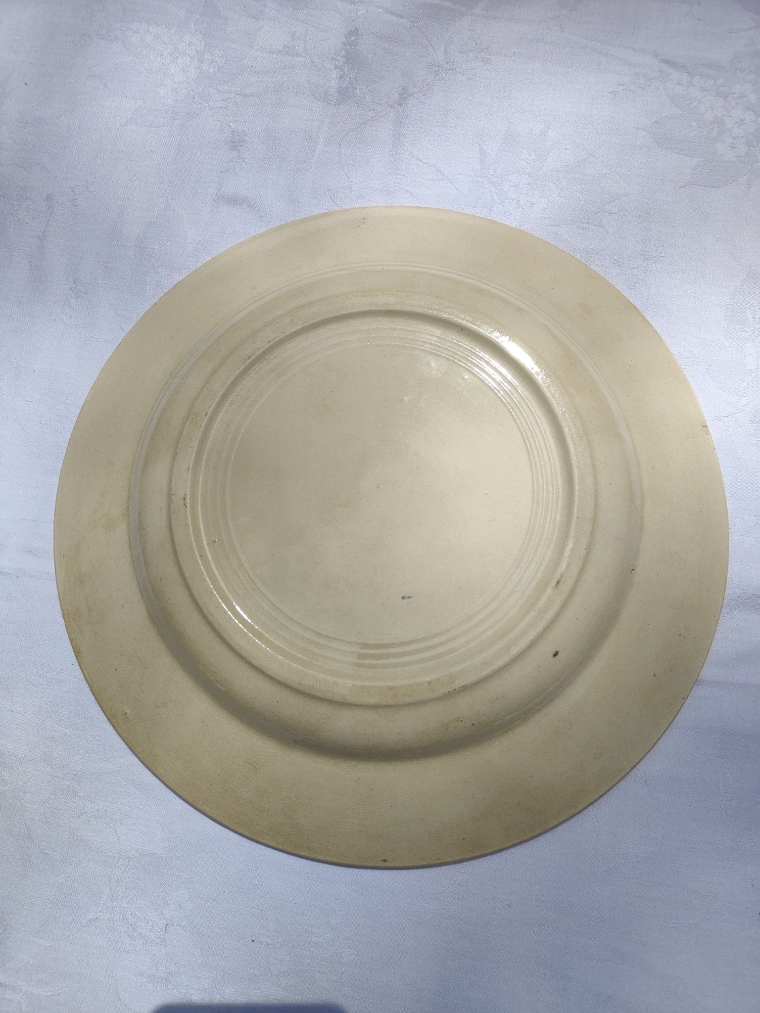 Flat round earthenware dish