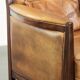 Cognac-coloured Art Deco design armchair made of sheepskin with a high back