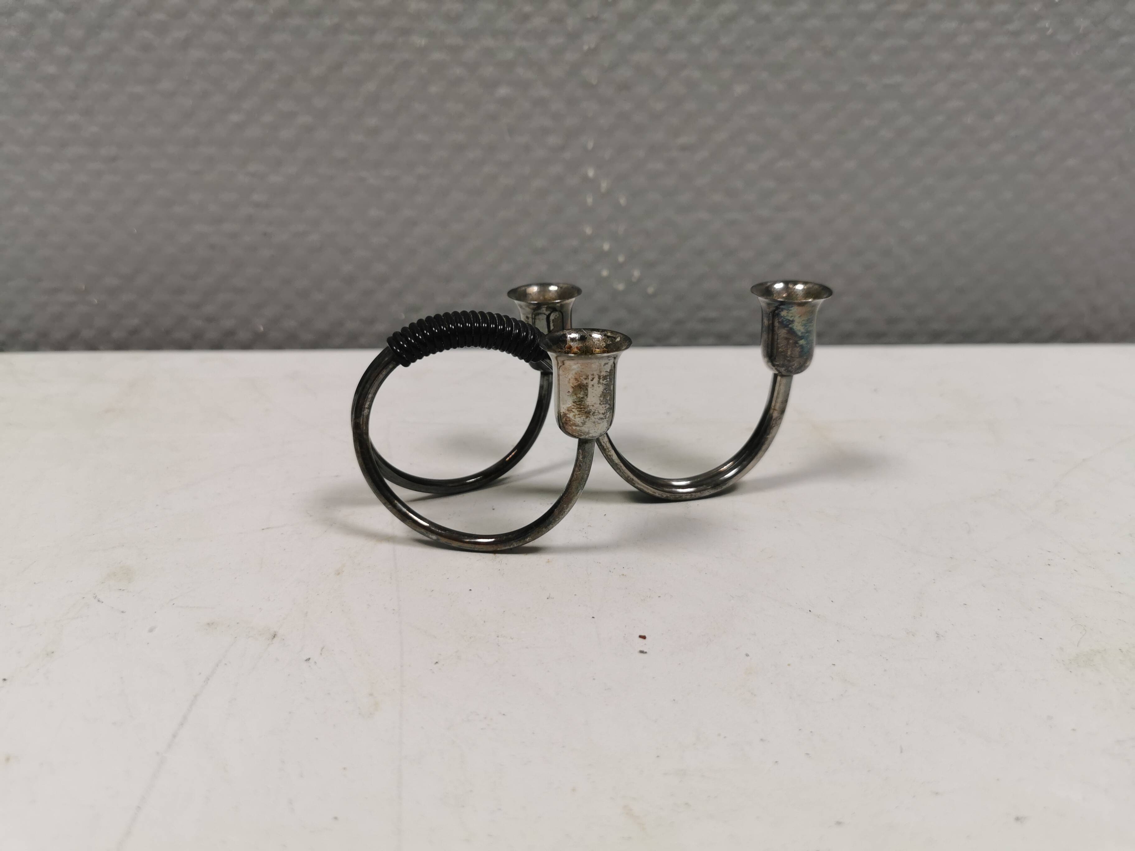 Small candle holder in tarnished silver, with place for three small candles