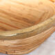 Corbeille vintage en rotin cerclée de laiton