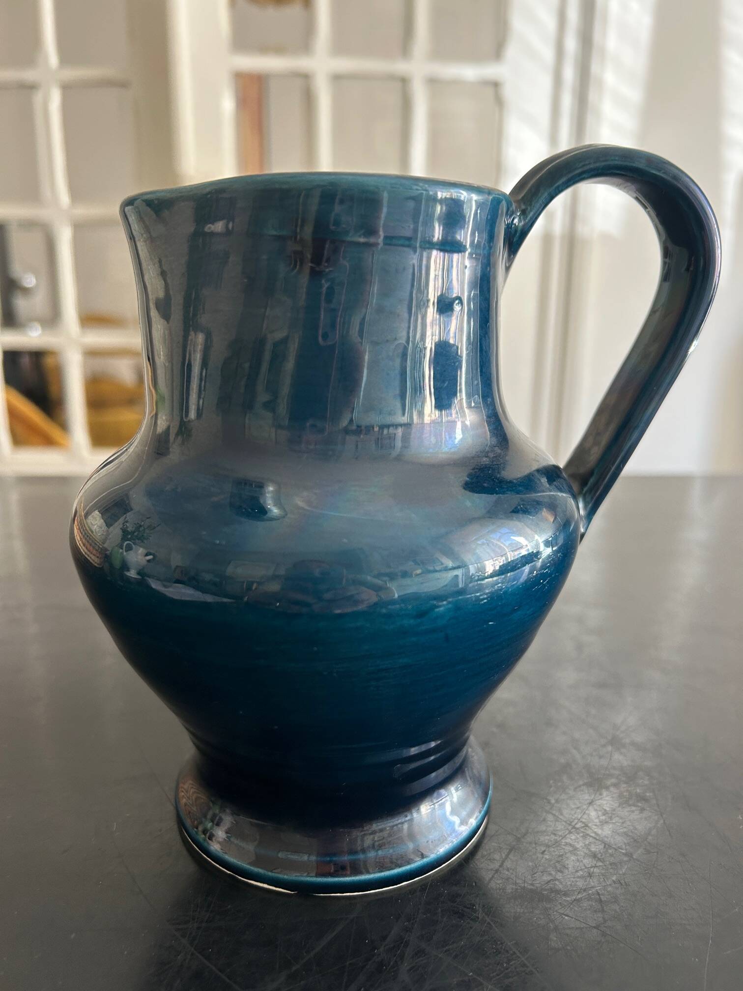 blue pitcher the potter chin