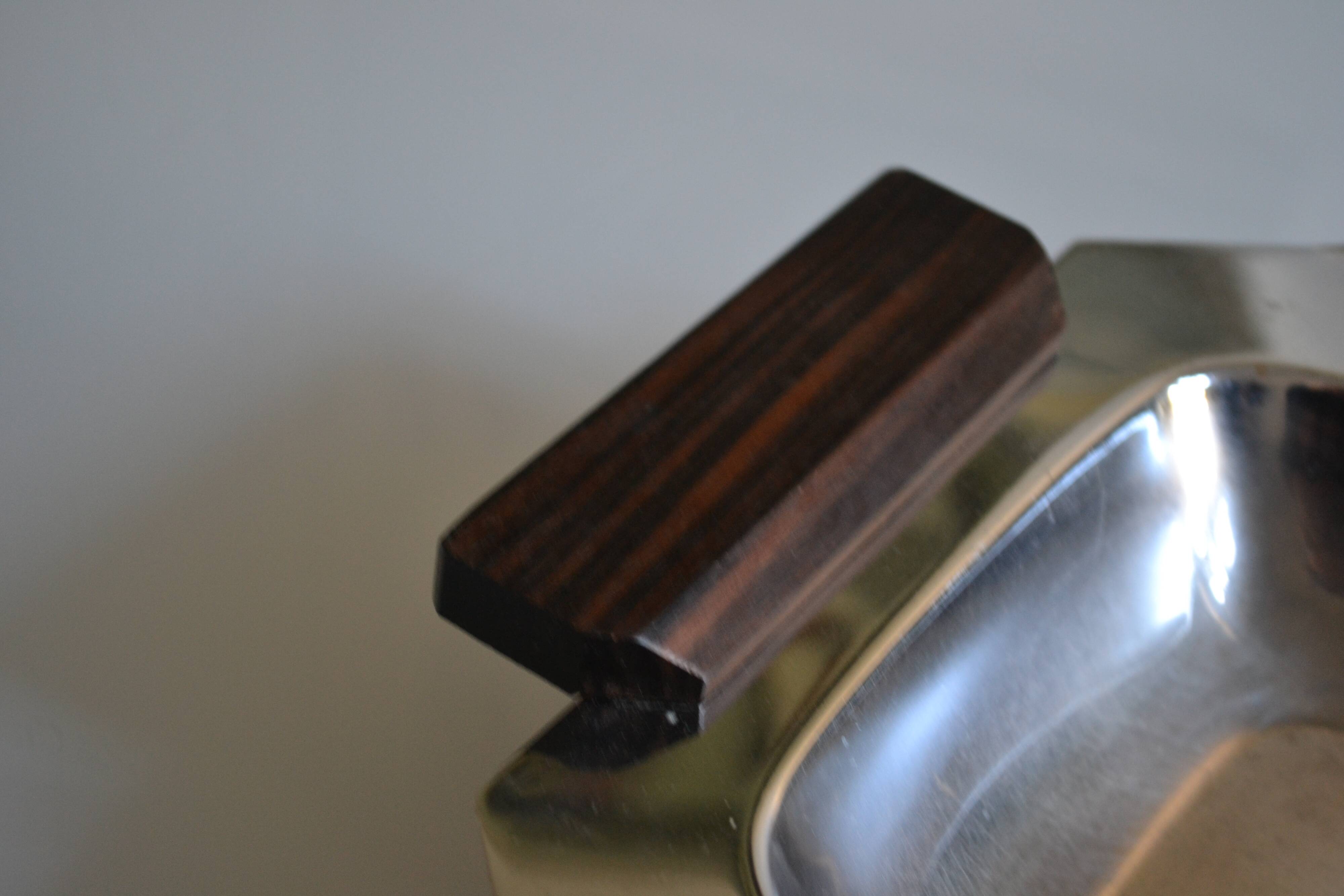 Art Deco serving dish in chrome metal with ebony handles.