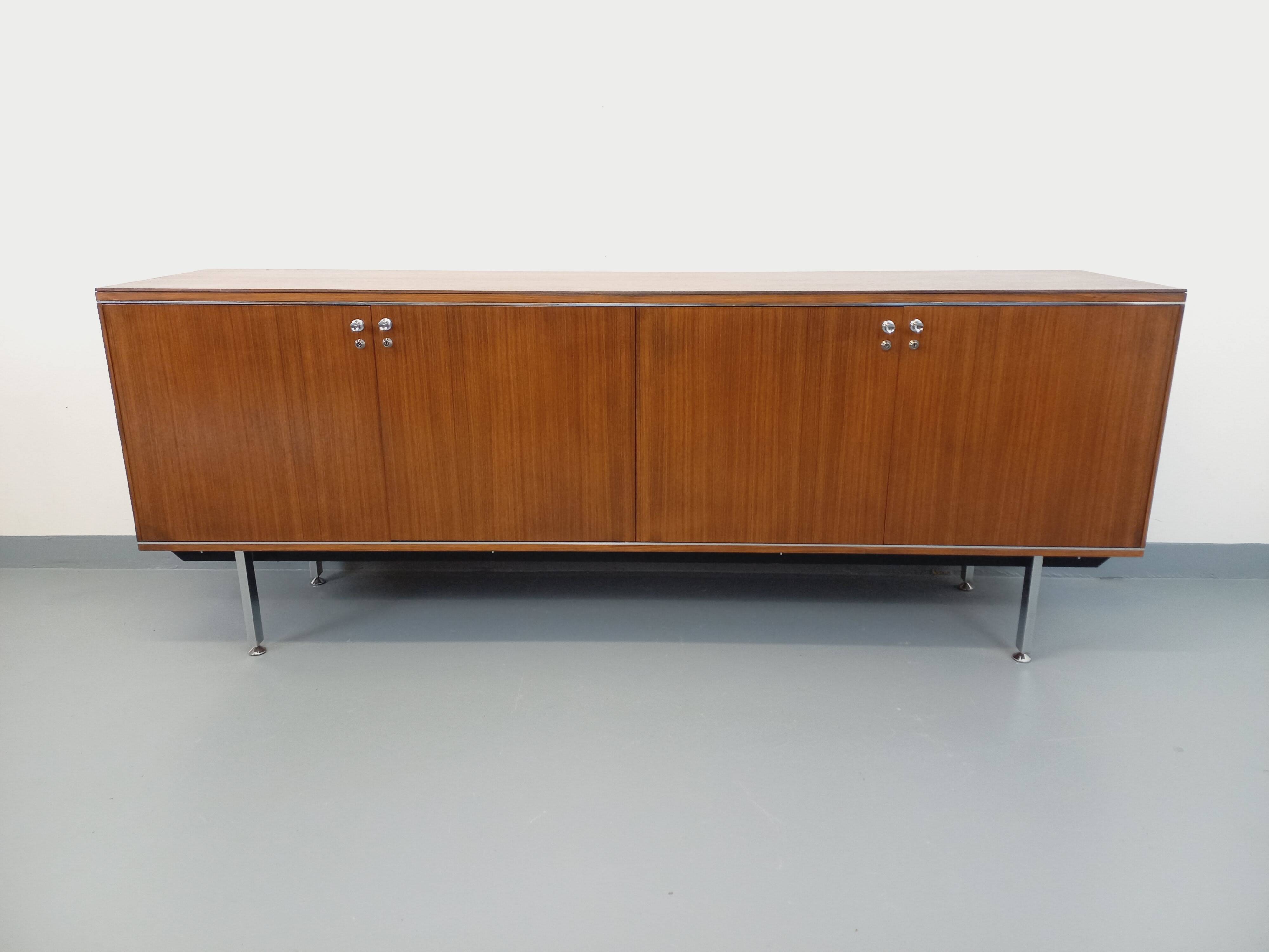 Vintage modernist enfilade in rosewood and chrome metal from the 60s and 70s.