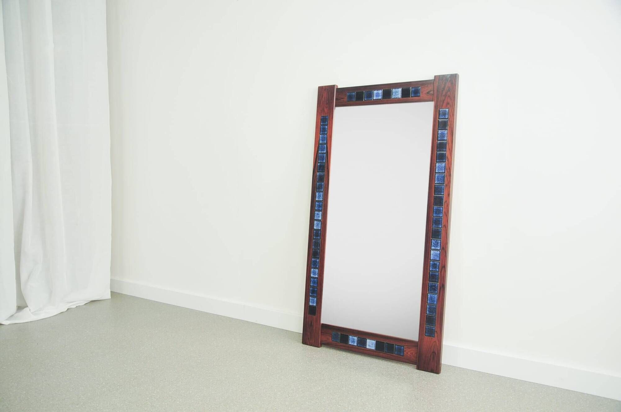 Rosewood mirror with blue ceramic tiles