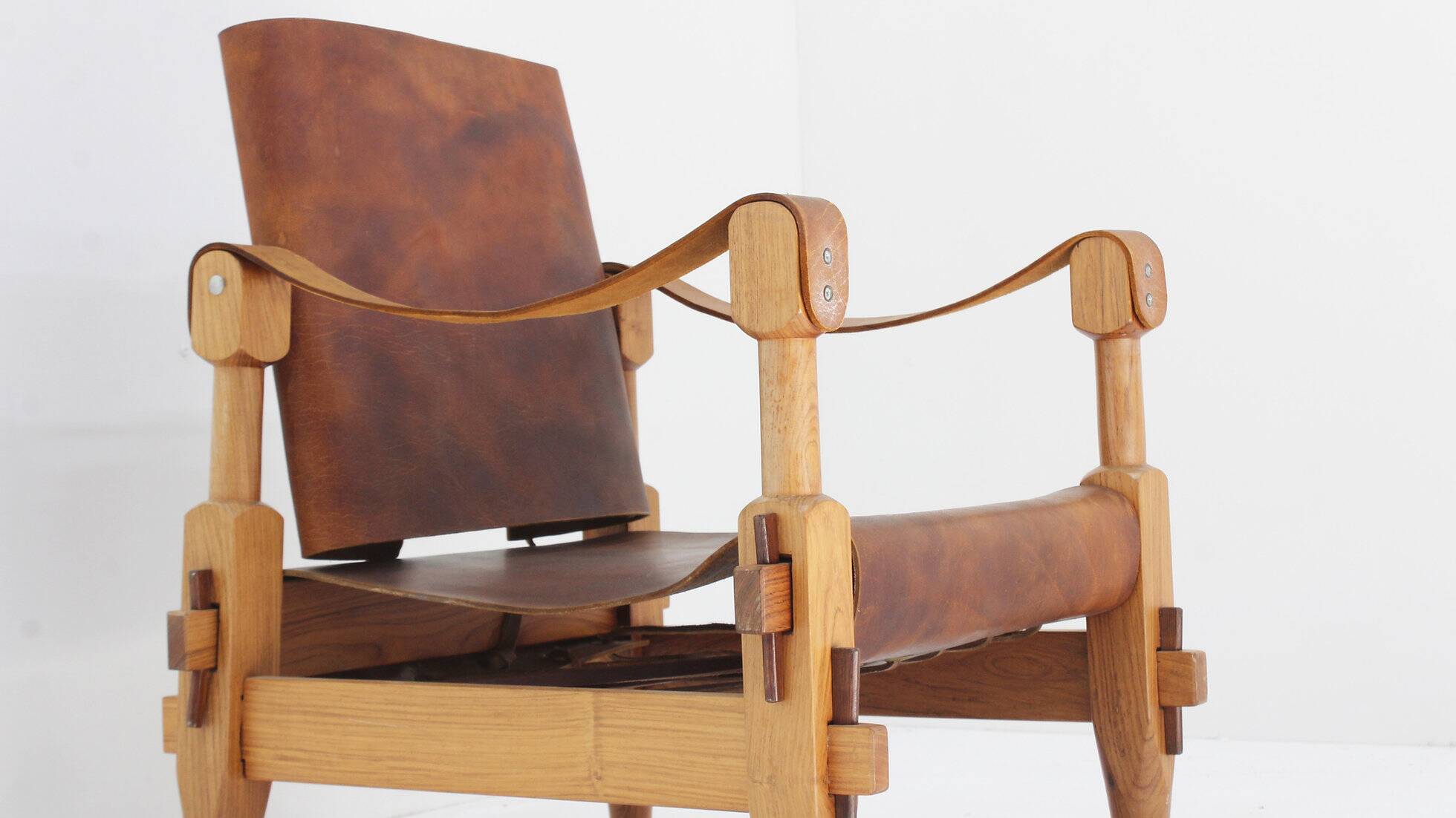 Vintage brutalist wood and cognac leather safari armchair, 1960s